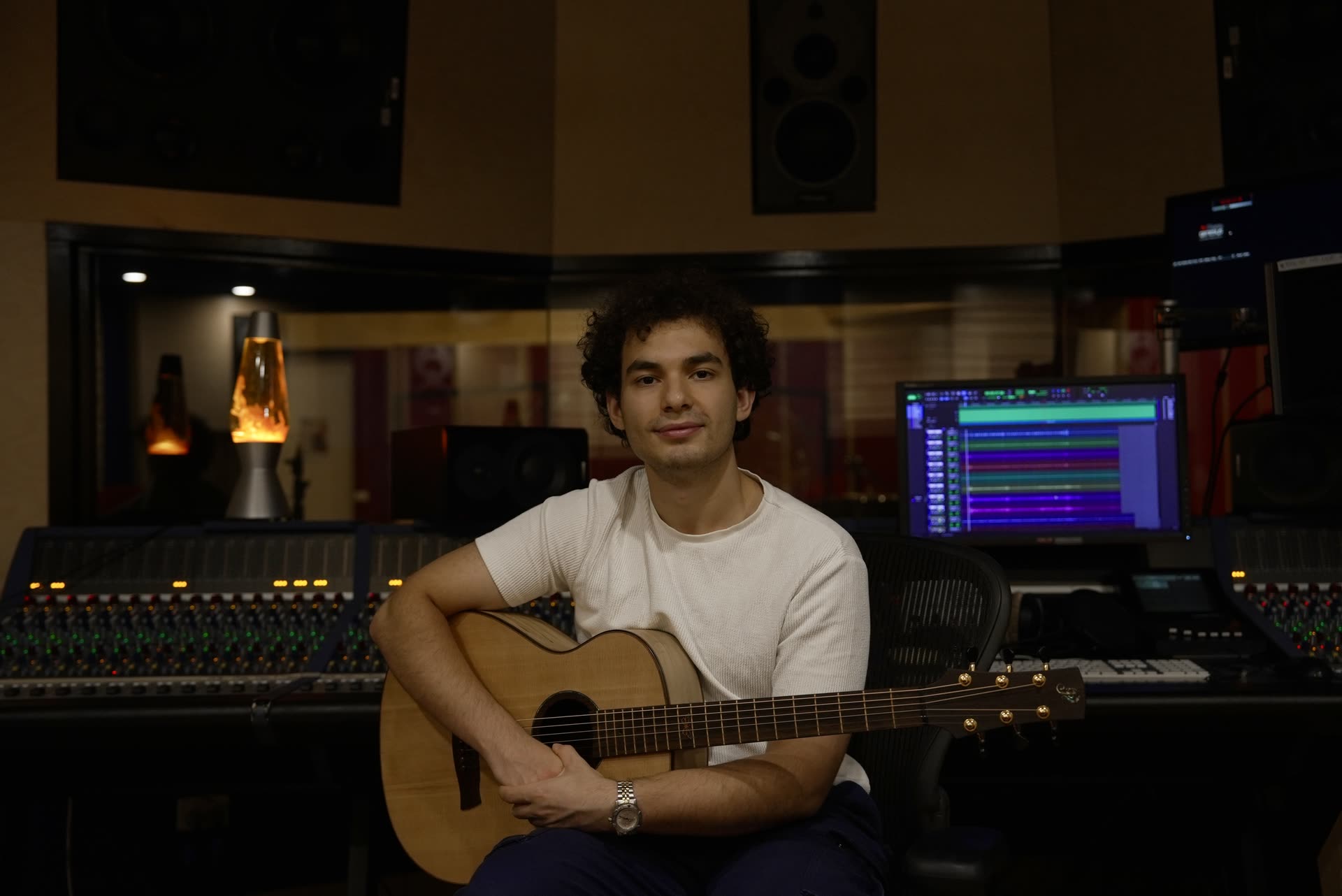 Mert Boyali working at a studio mixing console