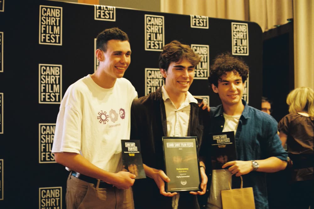 Mert Boyali with Taj Demontis and Spencer Wilds holding awards at the Canberra Short Film Festival